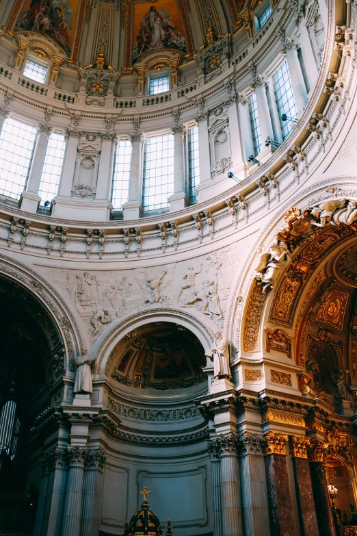 a church with an artistic ceiling and vaulted light