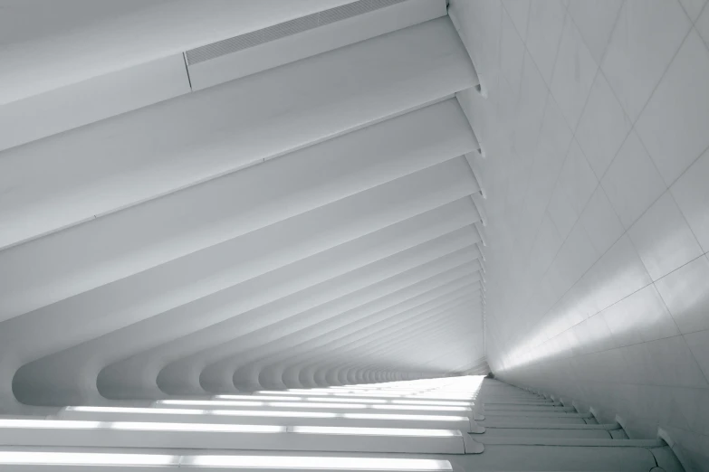 a large white building that has a curved roof