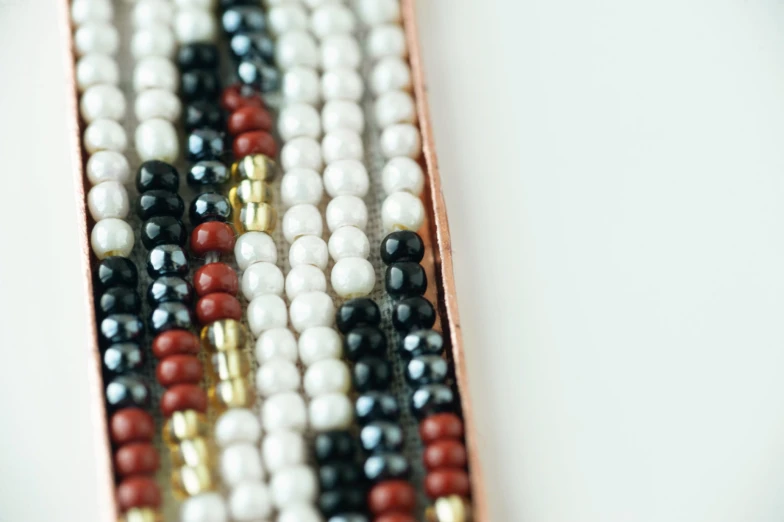 a close up of an assortment of colored beads