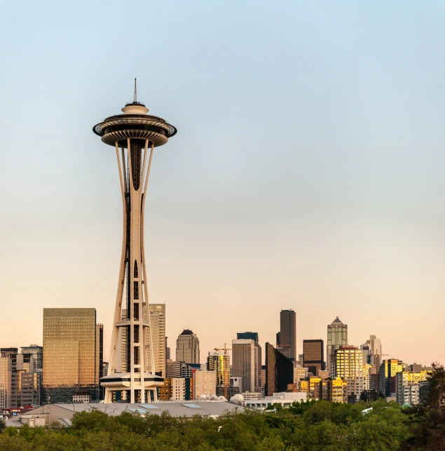 a city skyline and a tall tower are shown