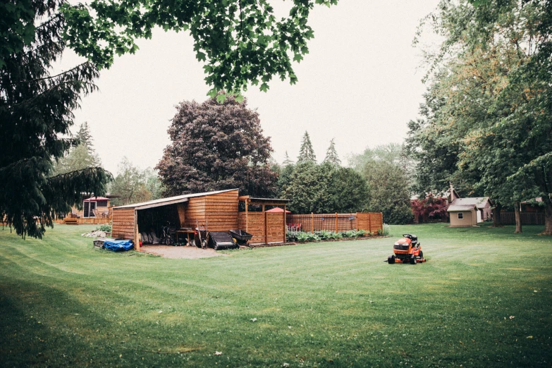 a person sitting on an atv outside a house