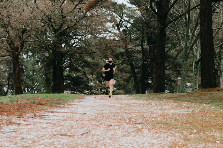 a man running in the park in a trail