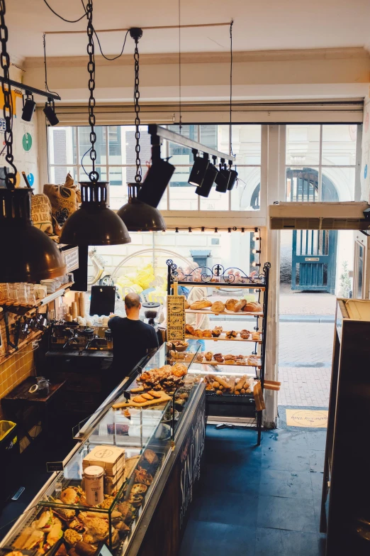 a bakery with the lights on and windows opened