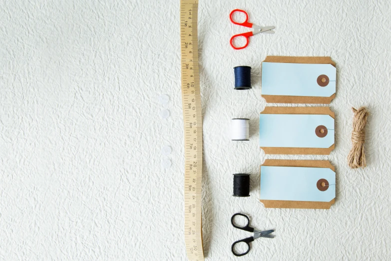 several craft supplies sit near a ruler