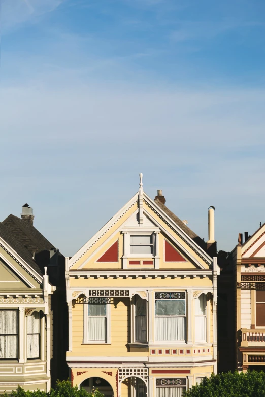 two houses one white and one brown are shown