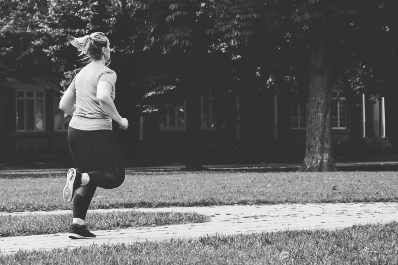 a woman that is standing in the grass