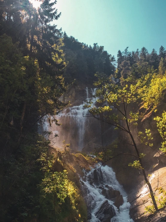 a large waterfall with water cascading down the side