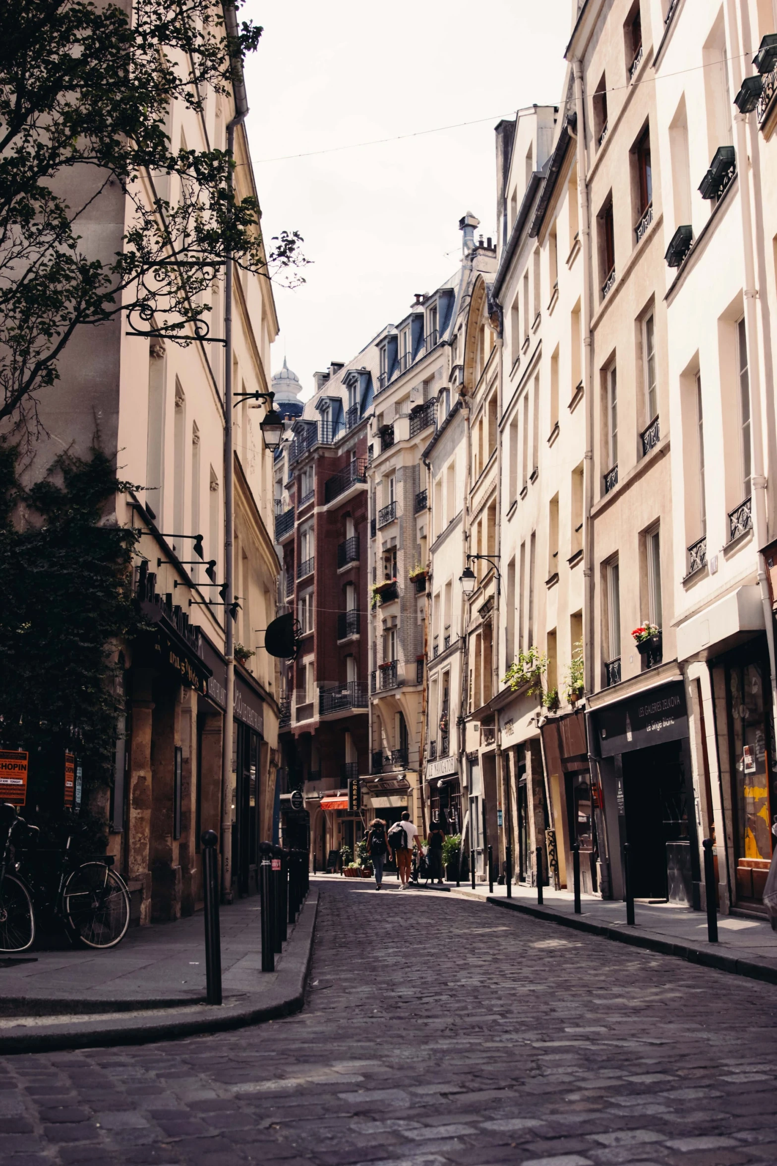 an old street in paris, with stone buildings