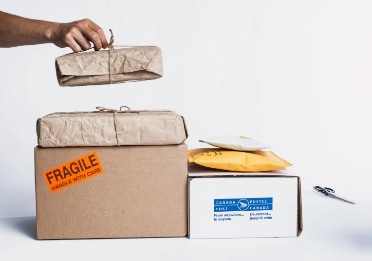 some bananas are in a cardboard box next to a banana