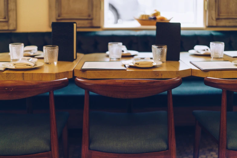 the restaurant is set up with two sets of chairs