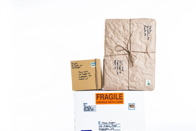 two packages of fragile are on top of the package