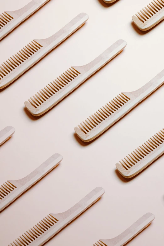 many toothbrushes lined up on a white background