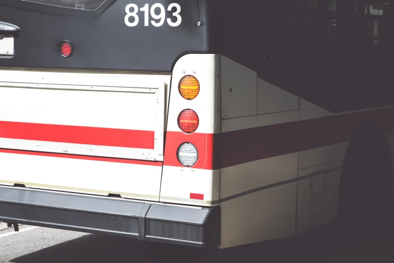 the tail lights on a bus are seen here