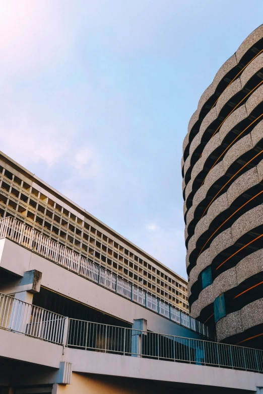 the side of a building with multiple balconies on top