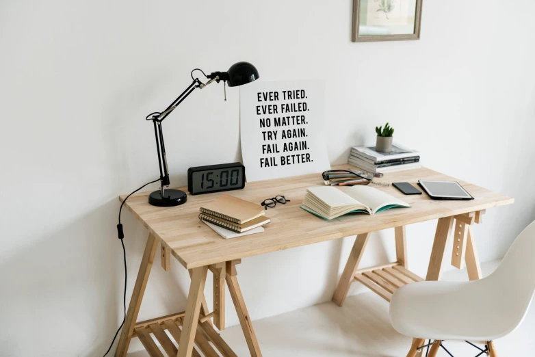 an office desk with a wooden computer table and chair