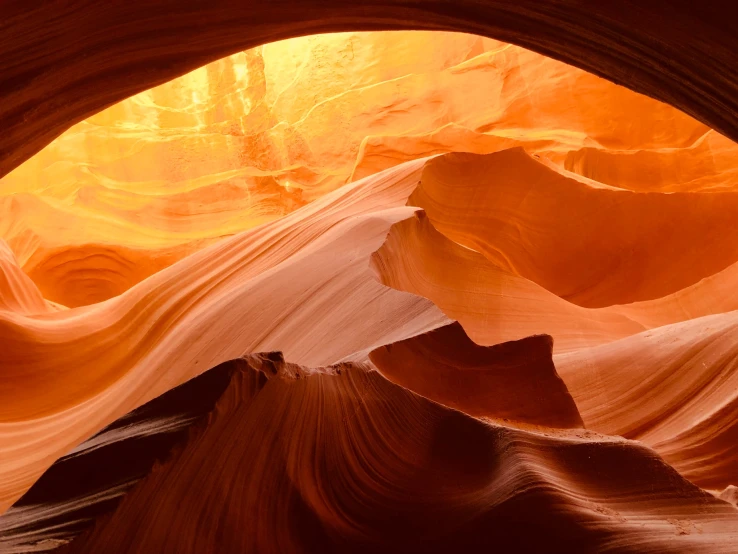 the inside of a rock formation looking up at it