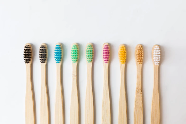 five brushes in different shapes sitting side by side