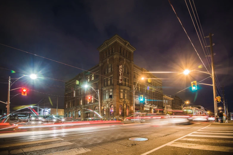 a view of an intersection in a city at night