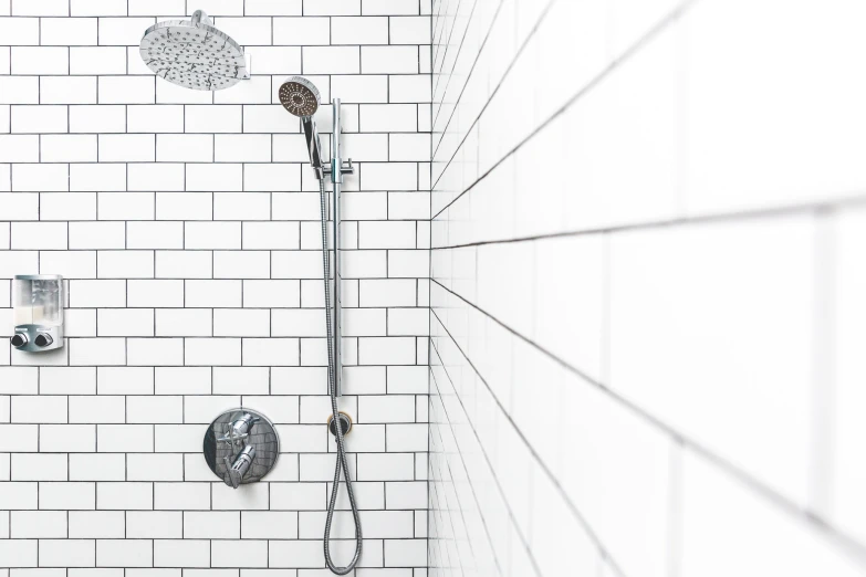a black and white image of some fixtures in a shower