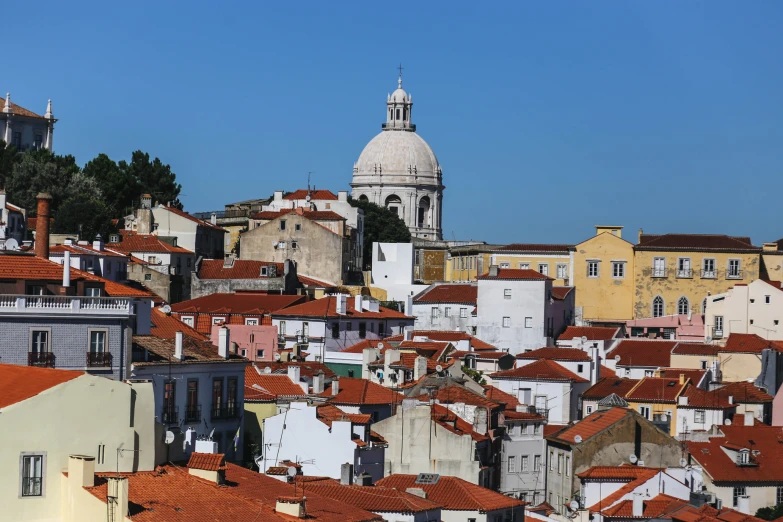 red and white roofs of small white houses in the city