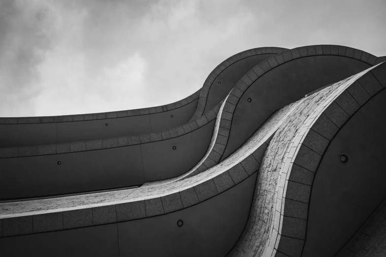 a large long building made of concrete sitting in the air