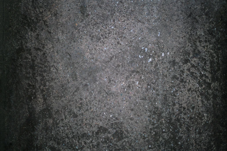 a closeup of the textured asphalt surface