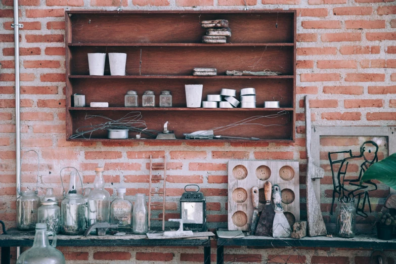 various items sit on the shelves outside of a building