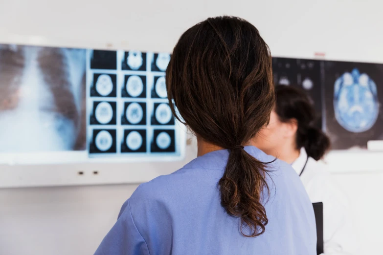a doctor looking at a patient with a lung scan
