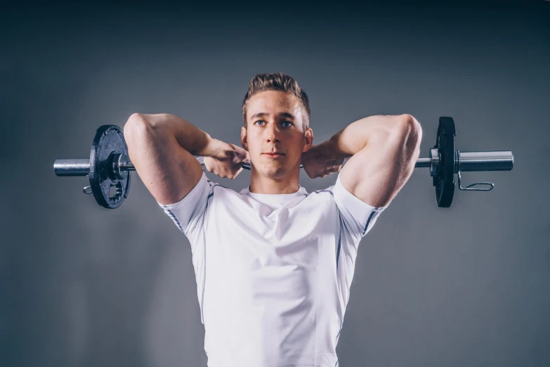 a man is lifting some dumb curls while he holds onto his hand