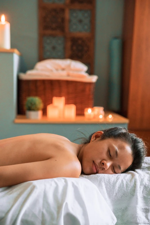 a woman laying down in a spa massage