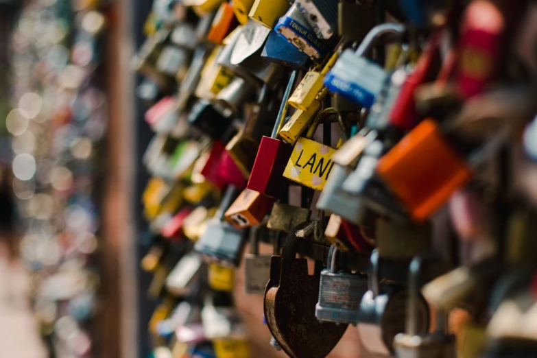 many locks and various tags on a wall