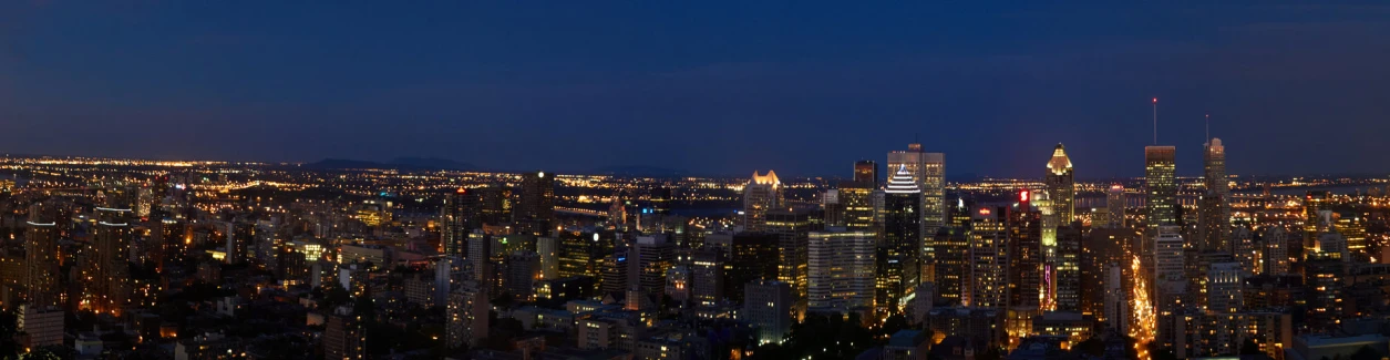 an aerial view of the city lit up at night