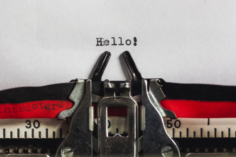 a close up image of scissors and a typewriter