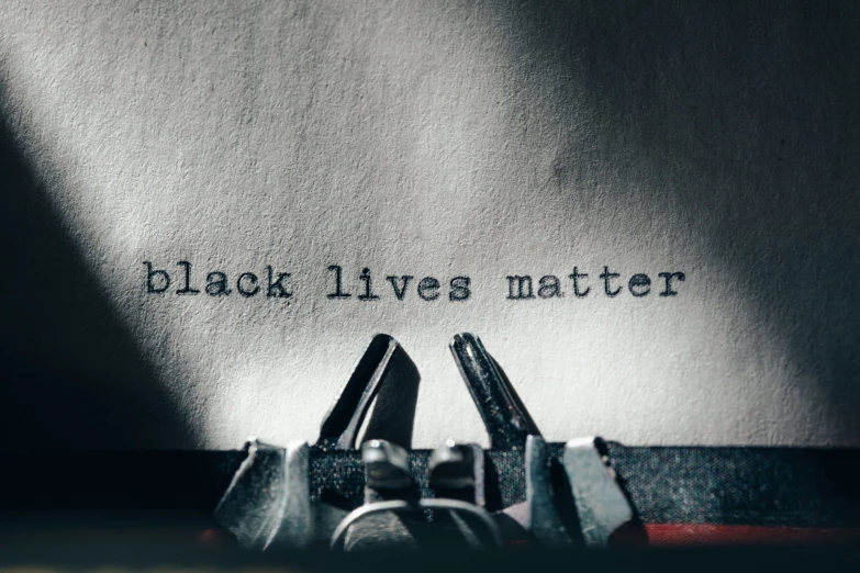 an old fashioned typewriter has black lives matter written on it
