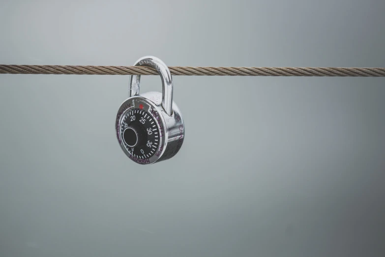 a couple of keys on top of a rope