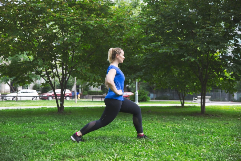 there is a woman that is running in the grass