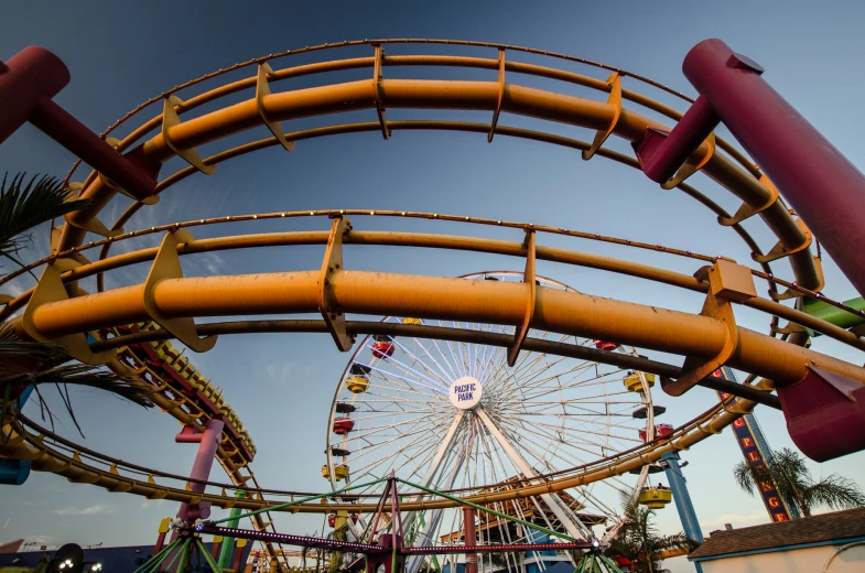 an amut park is shown with a ferris wheel