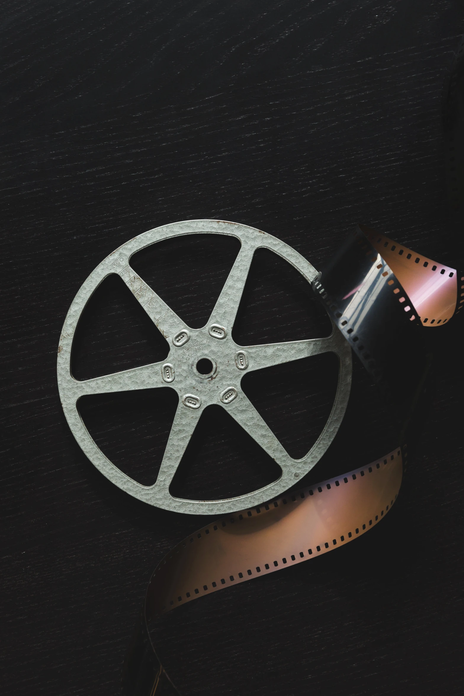 a close up of a film strip and an old projector camera