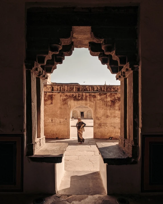 a person is sitting outside on the steps