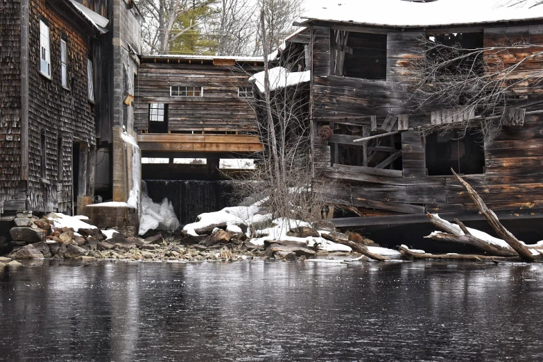 a large wooden building sitting next to water