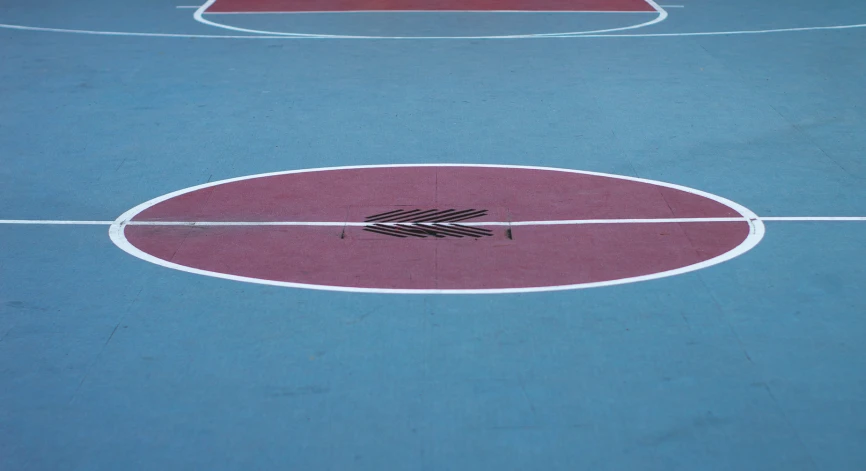 a basketball court with a black arrow on it