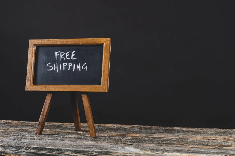 an image of free shipping written on a black board