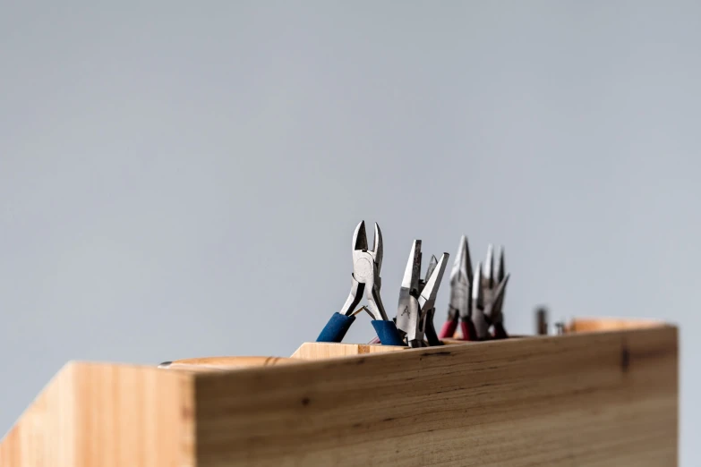 a number of different tool sets laying in an assembly box