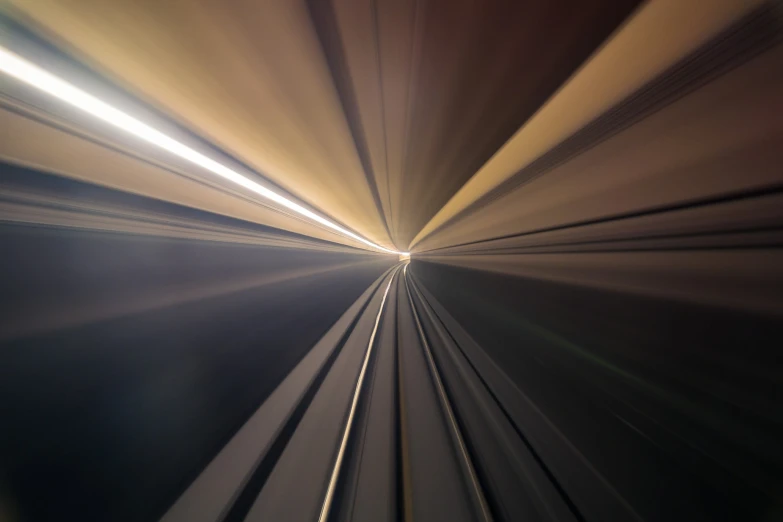 a blurry image of train tracks, taken from the inside of a car