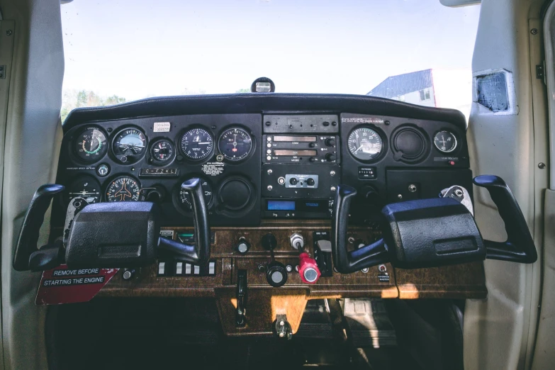 a very close up view of a control console in an airplane