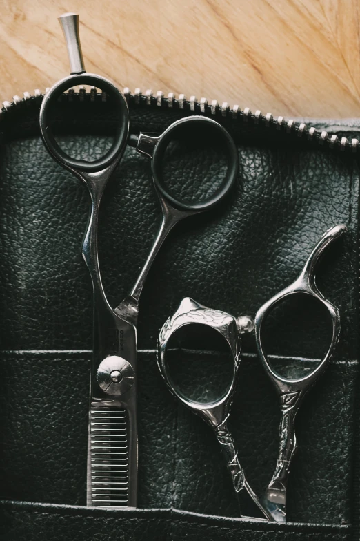 closeup of black hairdresser's pair of scissors