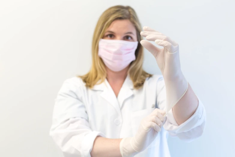 a woman wearing medical supplies and gloves