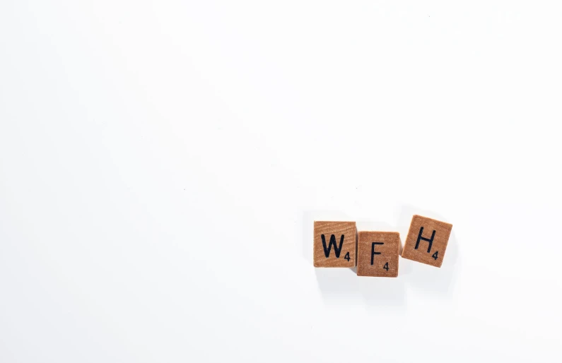 a wooden block spelling the word web on it