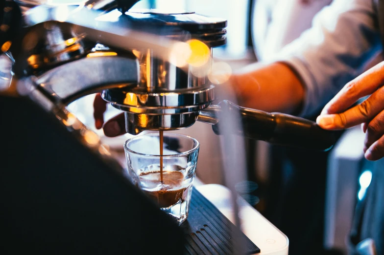 a baristac being used on a espresso machine