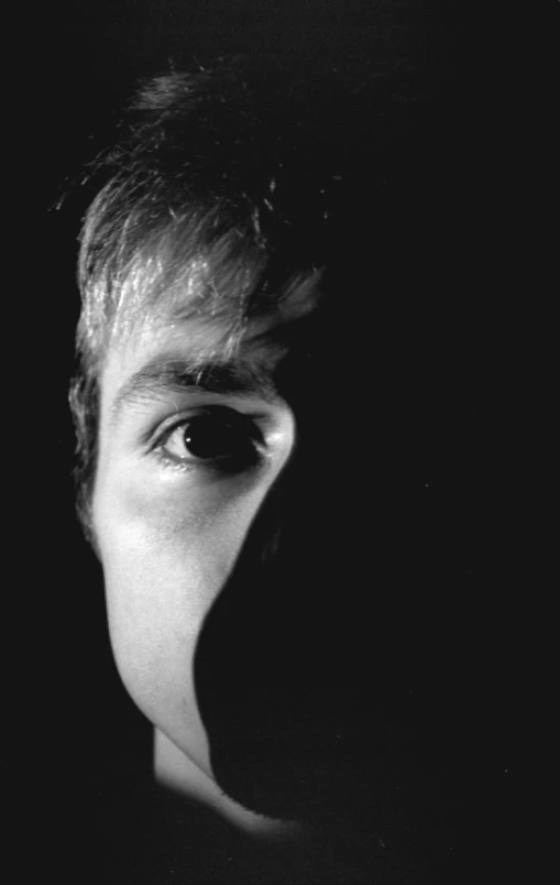 a boy's face as shown through an overexposed lens